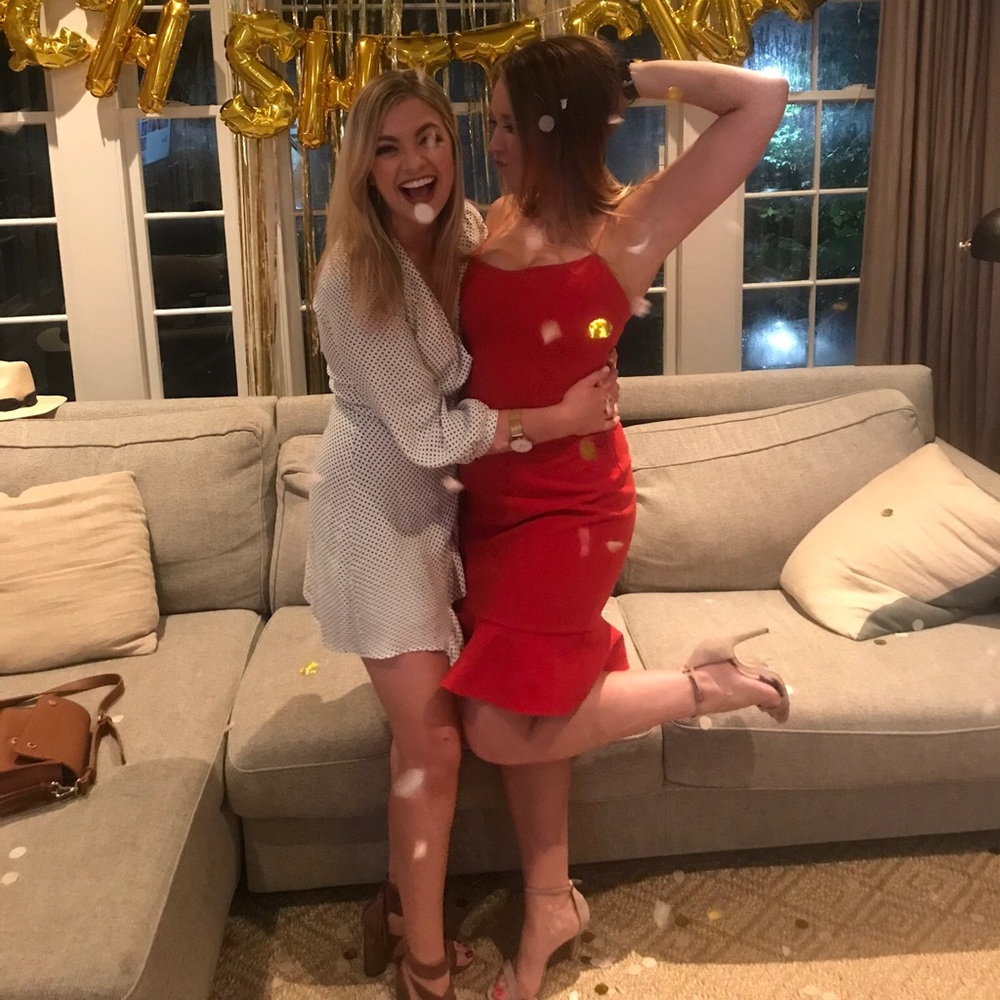 Likely mini dress with thin straps and bottom flounce